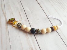 Load image into Gallery viewer, Exotic baby style binky holder with leopard beads and gold clip